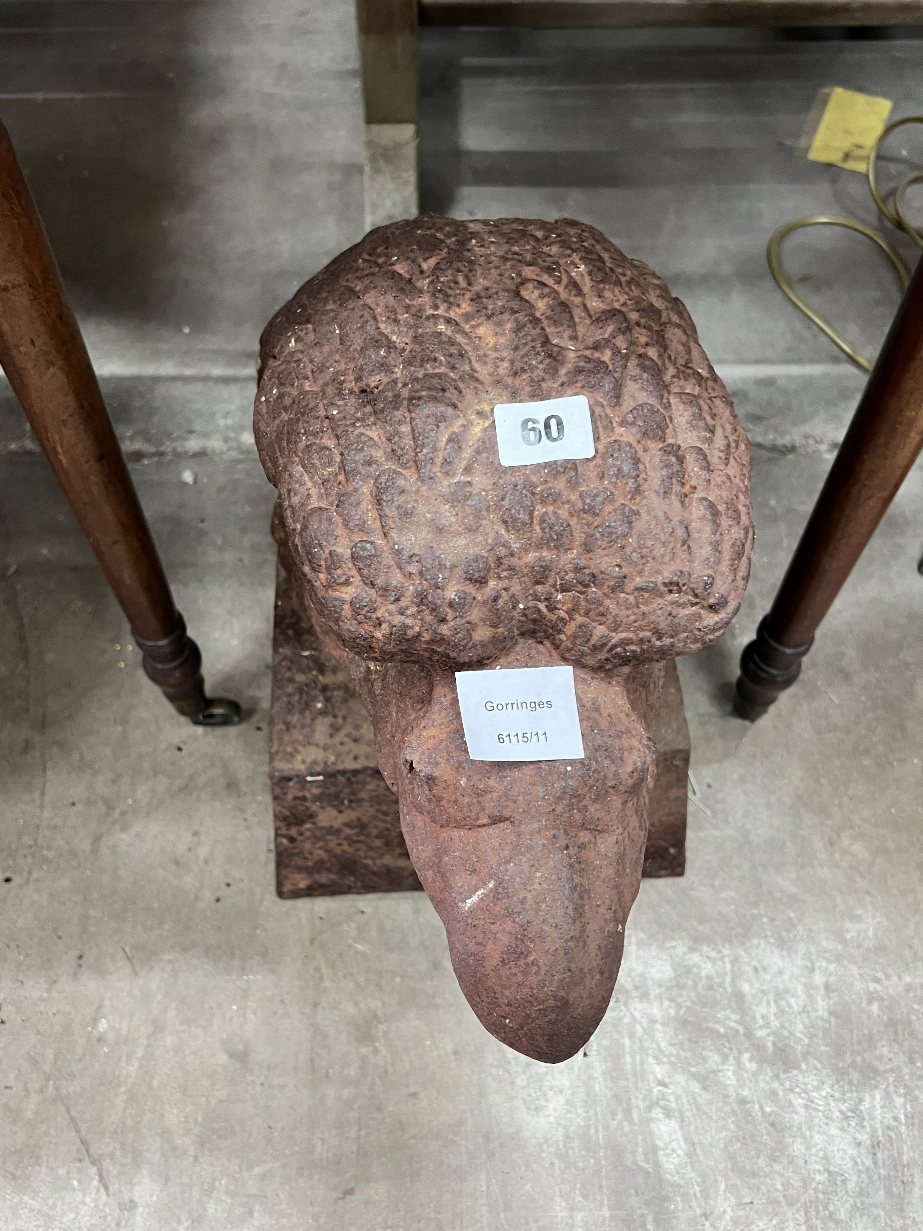 A large weathered cast iron eagle's head garden finial, height 44cm